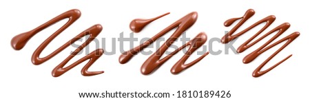 Chocolate sauce set isolated. Chocolate swirl on white top view. Chocolate syrup abstract pattern flat lay. Royalty-Free Stock Photo #1810189426
