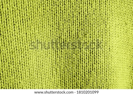 background of beautiful knitted fabric in green