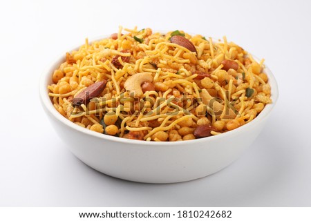 Traditional Indian snack, a mixture of cashew, peanuts, sev, boondi, spices. aslo called chiwda  Royalty-Free Stock Photo #1810242682