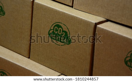 CO2 carbon neutral emission stamp printed on cardboard box. Ecology, nature friendly, climate change, green fuel and earth protect concept.