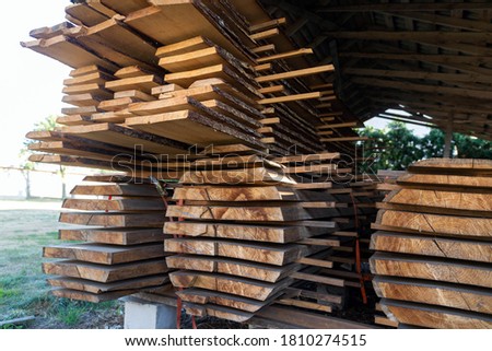 Stacks of cut wooden boards at the woodworker workshop, carpenter work