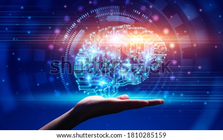 Modern Technologies And AI. Hand demonstrating digital brain hologram in circuit style, over abstract blue background, creative collage, panorama Royalty-Free Stock Photo #1810285159