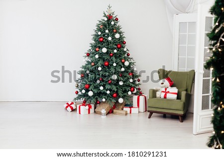 Christmas tree with gift decor for the new year winter in the white holiday card room