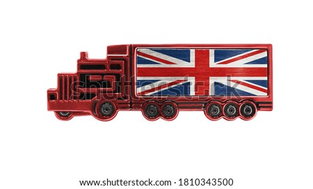 Toy truck with United Kingdom flag shown isolated on white background. The concept of cargo transportation between countries.