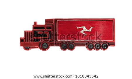 Toy truck with Isle Of Man flag shown isolated on white background. The concept of cargo transportation between countries.
