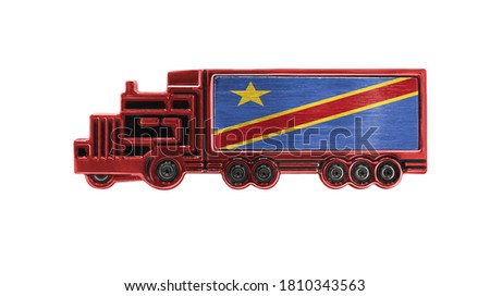 Toy truck with Congo Democratic flag shown isolated on white background. The concept of cargo transportation between countries.