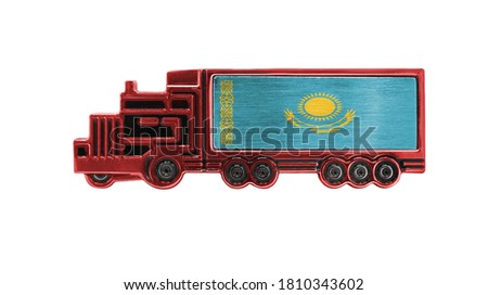 Toy truck with Kazakhstan flag shown isolated on white background. The concept of cargo transportation between countries.