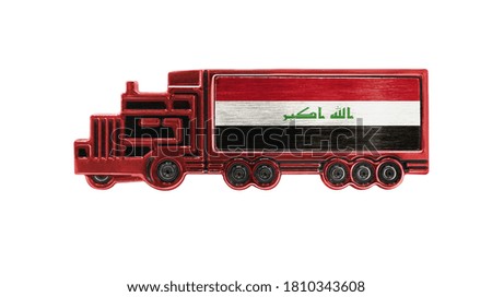 Toy truck with Iraq flag shown isolated on white background. The concept of cargo transportation between countries.