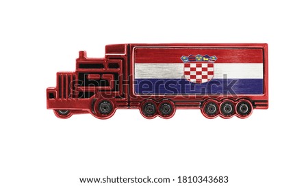 Toy truck with Croatia flag shown isolated on white background. The concept of cargo transportation between countries.