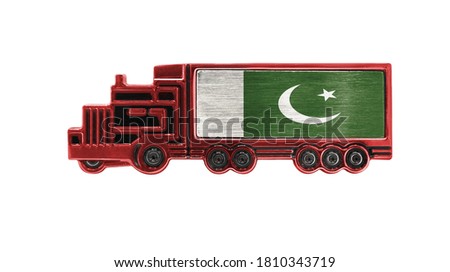 Toy truck with Pakistan flag shown isolated on white background. The concept of cargo transportation between countries.