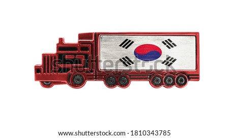 Toy truck with South Korea flag shown isolated on white background. The concept of cargo transportation between countries.