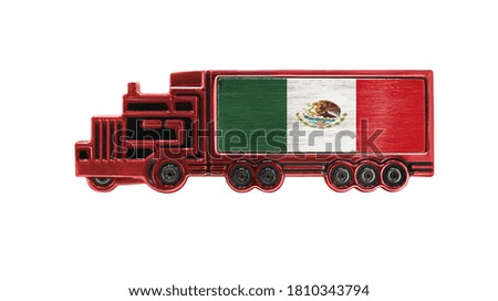 Toy truck with Mexico flag shown isolated on white background. The concept of cargo transportation between countries.