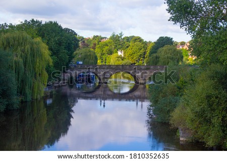 Bridge reflecting on the river Severn in Shrewsbury Shropshire Royalty-Free Stock Photo #1810352635