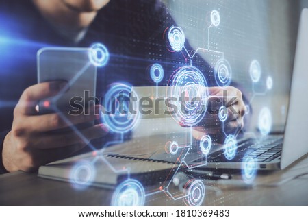 Multi exposure of man's hands holding and using a digital device and data theme drawing. Innovation concept. Royalty-Free Stock Photo #1810369483