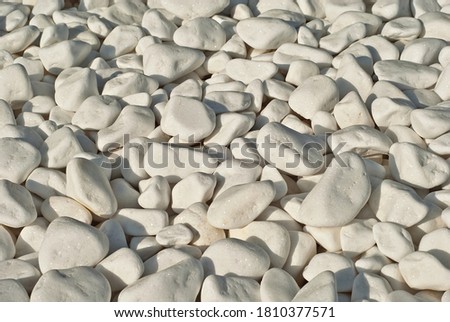 Drainage systems from small pebbles. Garden drainage for plants and trees. White stones for roads and flower beds.