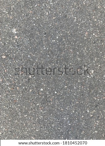 Asphalt texture at daylight and rough stones