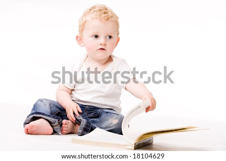 Cute caucasian blond toddler is happy and playfull