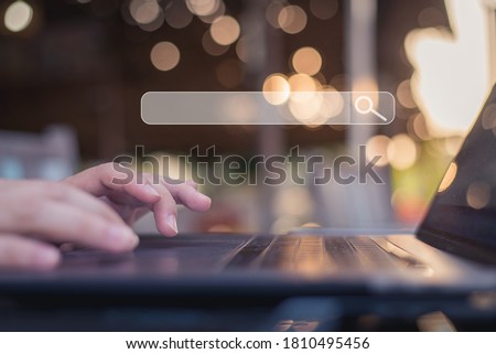 Business man using laptop, searching web, browsing information, having workplace at home or cafe.
