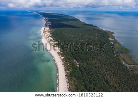 Beautiful aerial drone wide view of Curonian spit, Kurshskaya Kosa National Park, Curonian Lagoon and the Baltic Sea,  Kaliningrad Oblast, Russia and Klaipeda County, Lithuania, summer day Royalty-Free Stock Photo #1810523122
