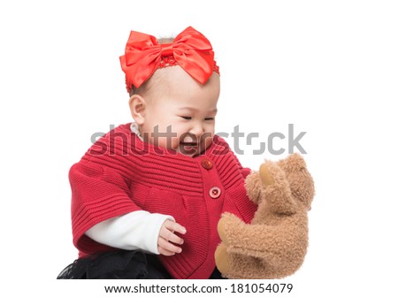 Asia baby girl play doll bear