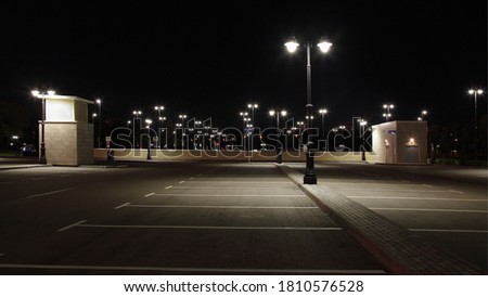 Empty outdoor contemporary Moscow car Parking with streetlights in family children's Park Island of Dreams on Andropova avenue on a summer night Royalty-Free Stock Photo #1810576528