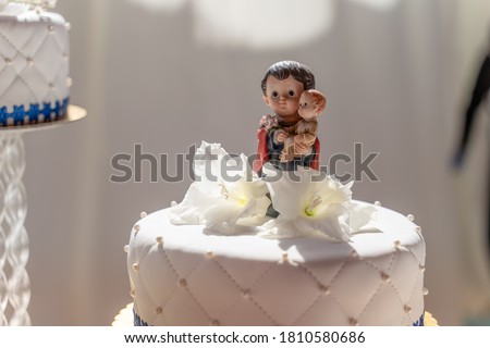 white cake designed for a wedding with a religious image