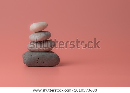 Zen stones on a pink background. Place for copy paste. Royalty-Free Stock Photo #1810593688