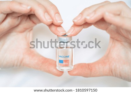 Vial with new usa, american vaccine for covid-19 coronavirus, flu, infectious diseases. Hand of doctor, nurse. Injection after clinical trials for vaccination of human, people. Medicine,drug concept.