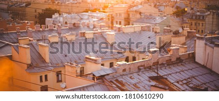 Blured city roof view at sunset, old town buildings on sunlight for background. banner. Saint-Petersburg, Russia