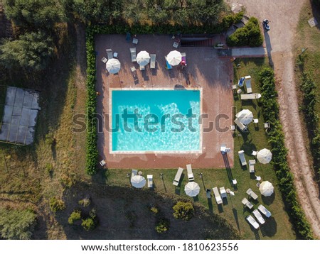 Aerial view of swimming pool with shower outdoors. Beautiful pool with clear water as texture background concept