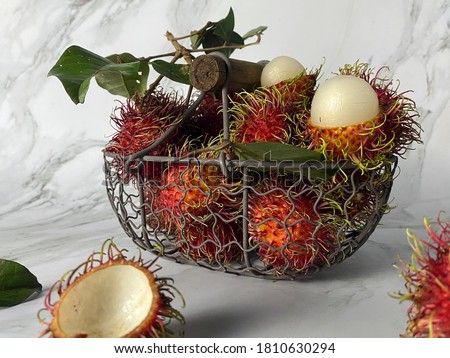 Tropical fruits, Rambutans or Rambutan budak sekolah on the table. 