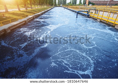 Water treatment tank in modern wastewater factory, cleaning and filtration before draining to river Royalty-Free Stock Photo #1810647646