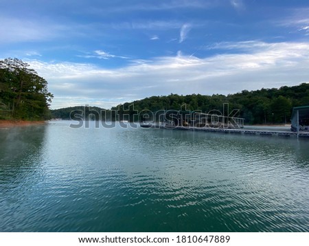 Norris Lake Tennessee Blue Sky Green Water and Boating Royalty-Free Stock Photo #1810647889