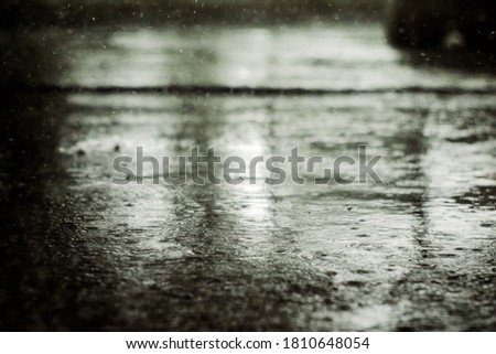 Asphalt in heavy rain on a cloudy day.