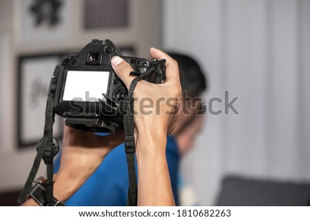 Videographer in the backside of camera are shooing and recording video in Wedding Event.