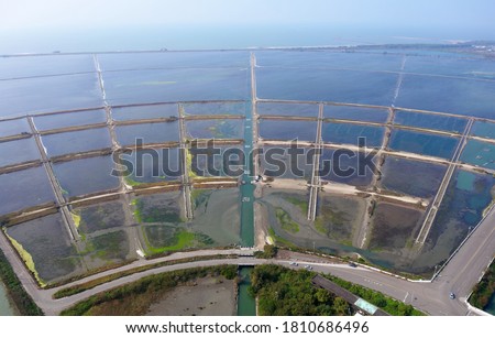 Aerial panoramic view of Qingkunshen salt fields (saltern) under sunny sky, which, though abandoned now, is famous for its beautiful fan-shaped layout, in Jiangjun, Tainan, Taiwan, Asia