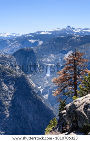 View of Vernal Fall and Nevada Falls, the Mist Trail, from Glacier Point with blue sky in summer, Yosemite National Park, California