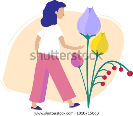the girl pulls her hand to the tulips