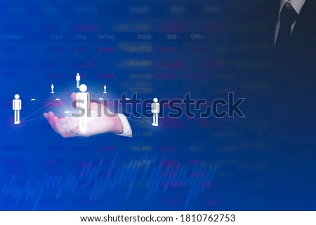 Businessman holding line people network and line control in graph Screen Icon of a media screen, Business and Graphics line computing and technology concept.