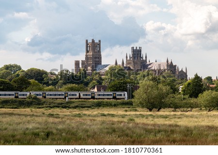 Ely Cathedral with train in foreground Royalty-Free Stock Photo #1810770361