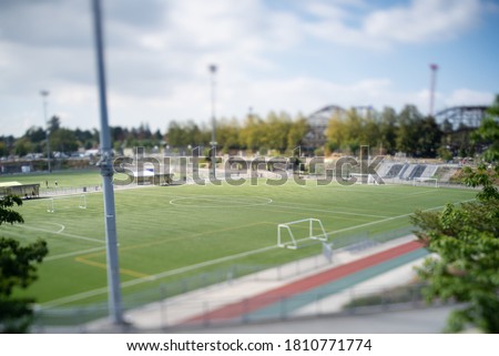 A picture of some football fields taken with tilt-shift effect.  