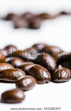 a macro shot of coffee beans with shallow depth of field.