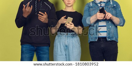 Group of friends using mobile smartphones