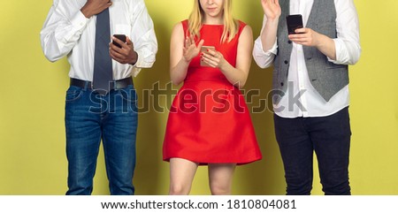 Group of friends using mobile smartphones