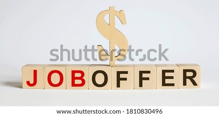 Text JOB OFFER on wood cube block, stock investment concept.