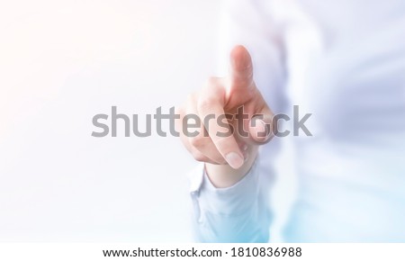 businesswoman presses on transparent touch screen. new technology Royalty-Free Stock Photo #1810836988