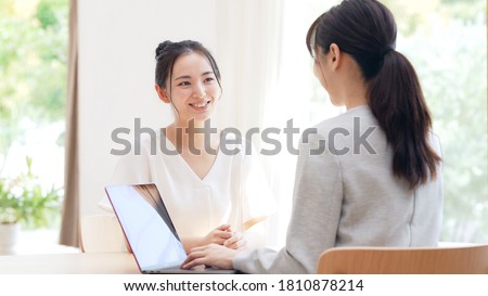 Meeting young asian women in the room. Consultant. Royalty-Free Stock Photo #1810878214