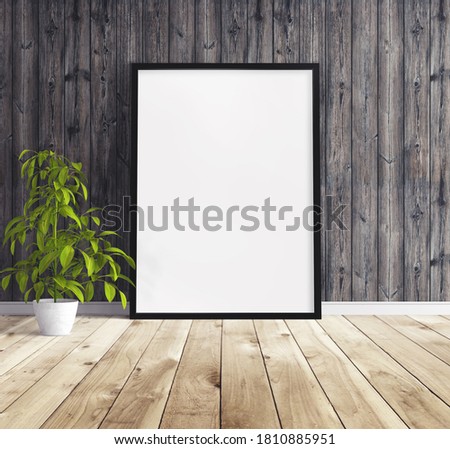 Blank vertical big poster with black frame standing on floor. Mockup template for you design.