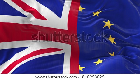 Large Union Jack And The Flag Of The European Union  waving in the wind. Brexit concept picture