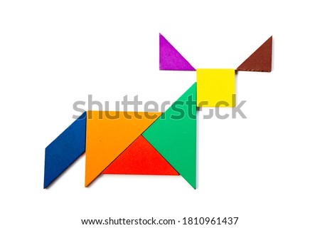 Color wood tangram puzzle in ox, buffalo or bull shape on white background